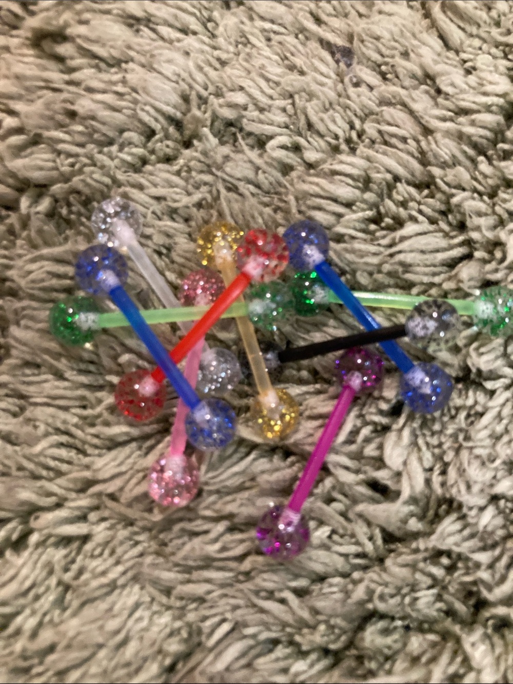 Two randomly plastic glitter ball tongue rings. Brand new